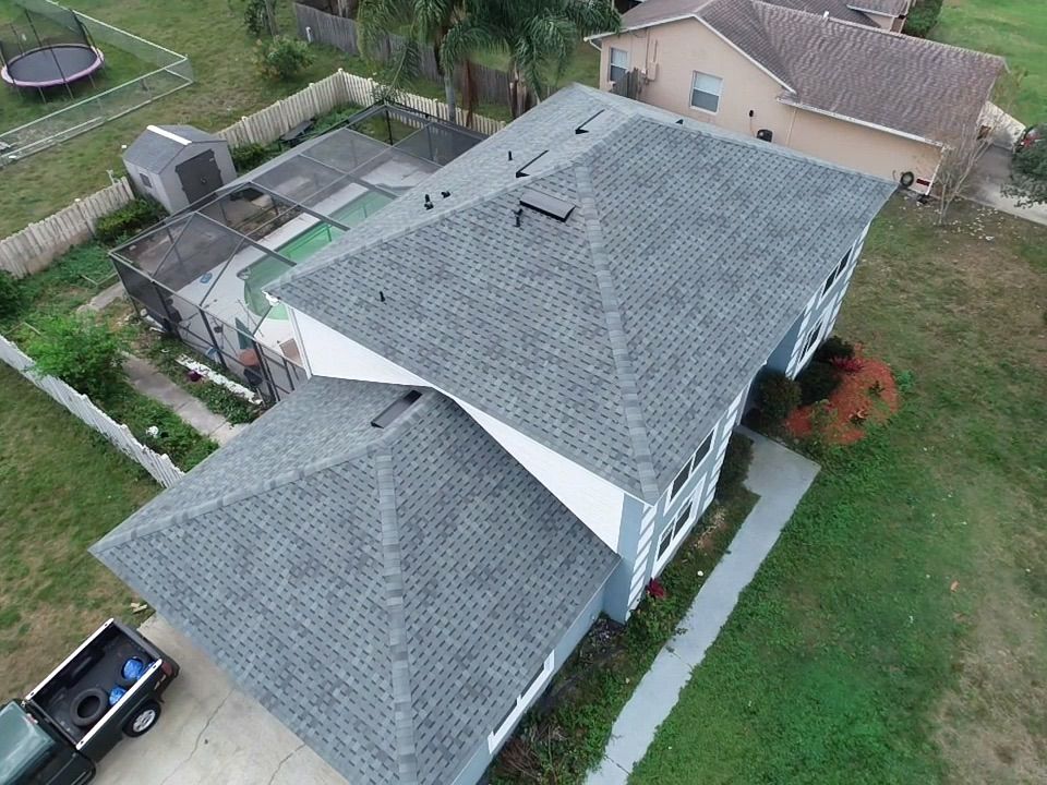 Overhead view of a multi leveled roof with a new shingles in Greater Orlando, Florida