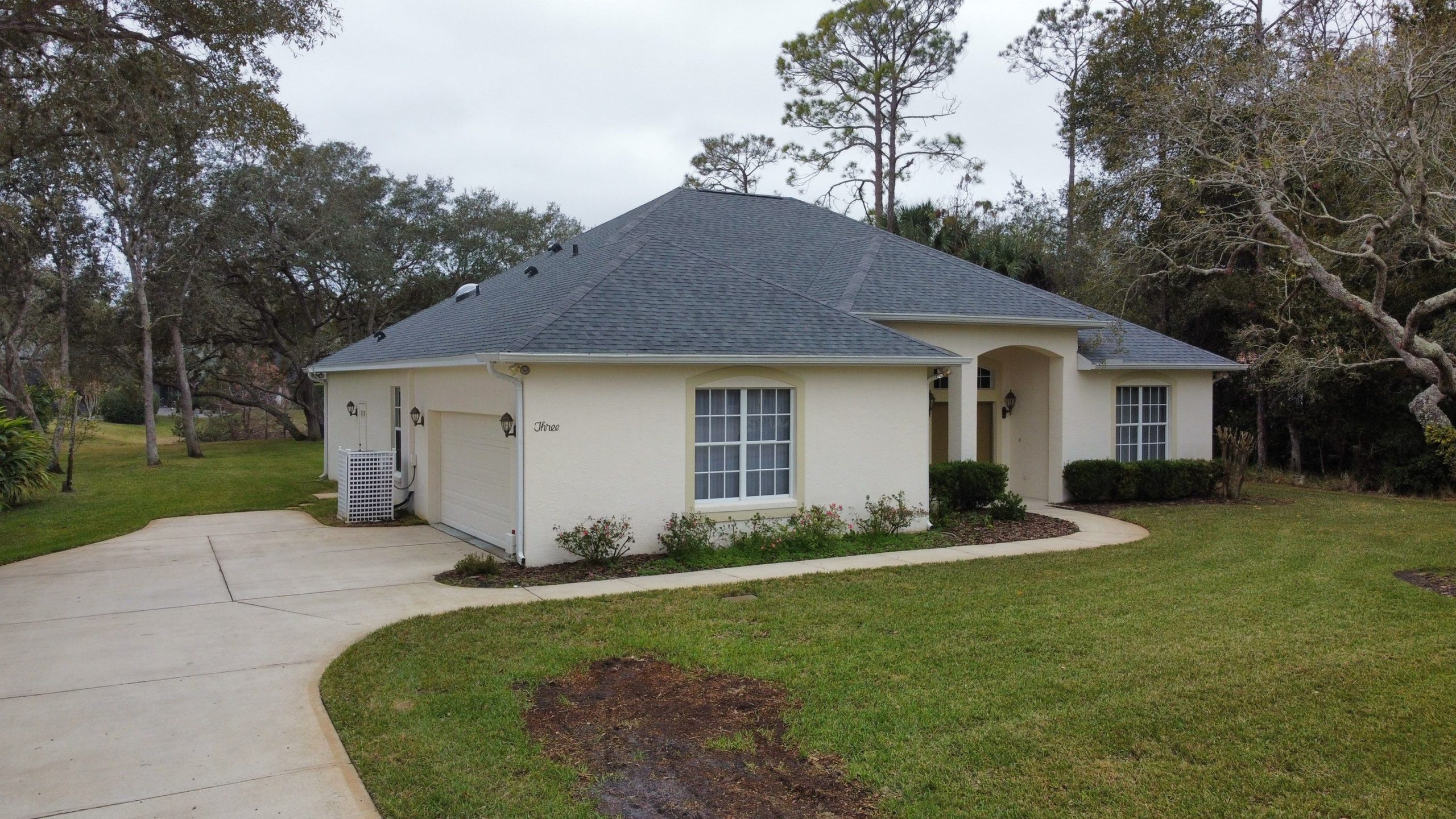 Curbside view of a newly shingled roof in Greater Orlando, FL