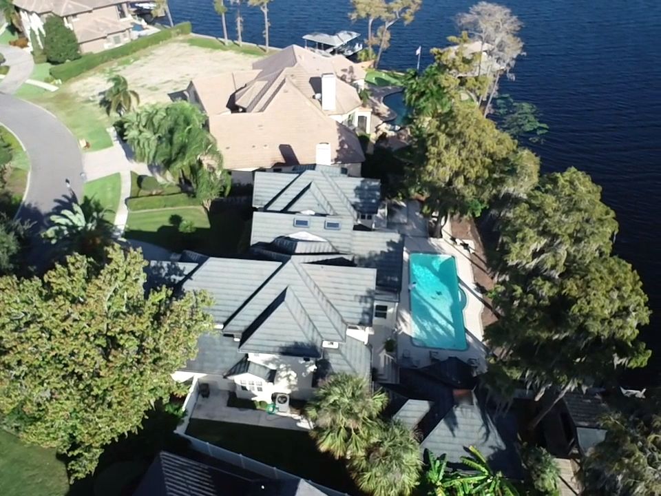Arial view of a large home with a new roof in Windermere, FL.
