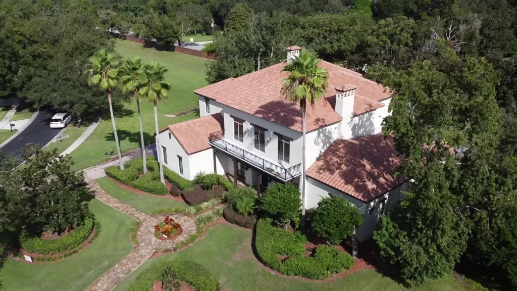 Aerial view of a Florida home with a new tile roof installed by Nine Square Roofing.