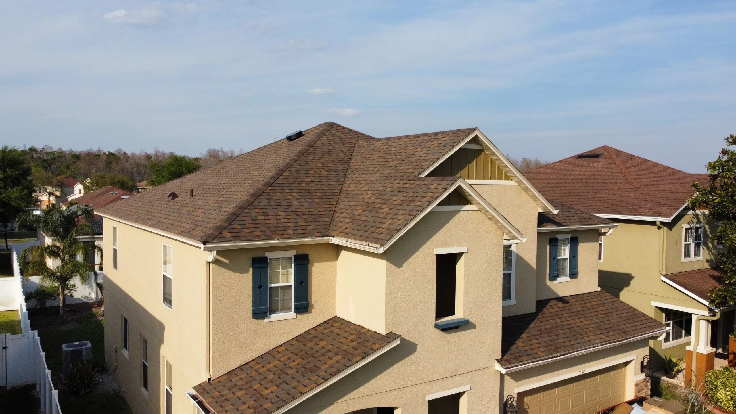 A multi-level asphalt shingle installation on a home in Longwood Florida installed by Nine Square Roofing.